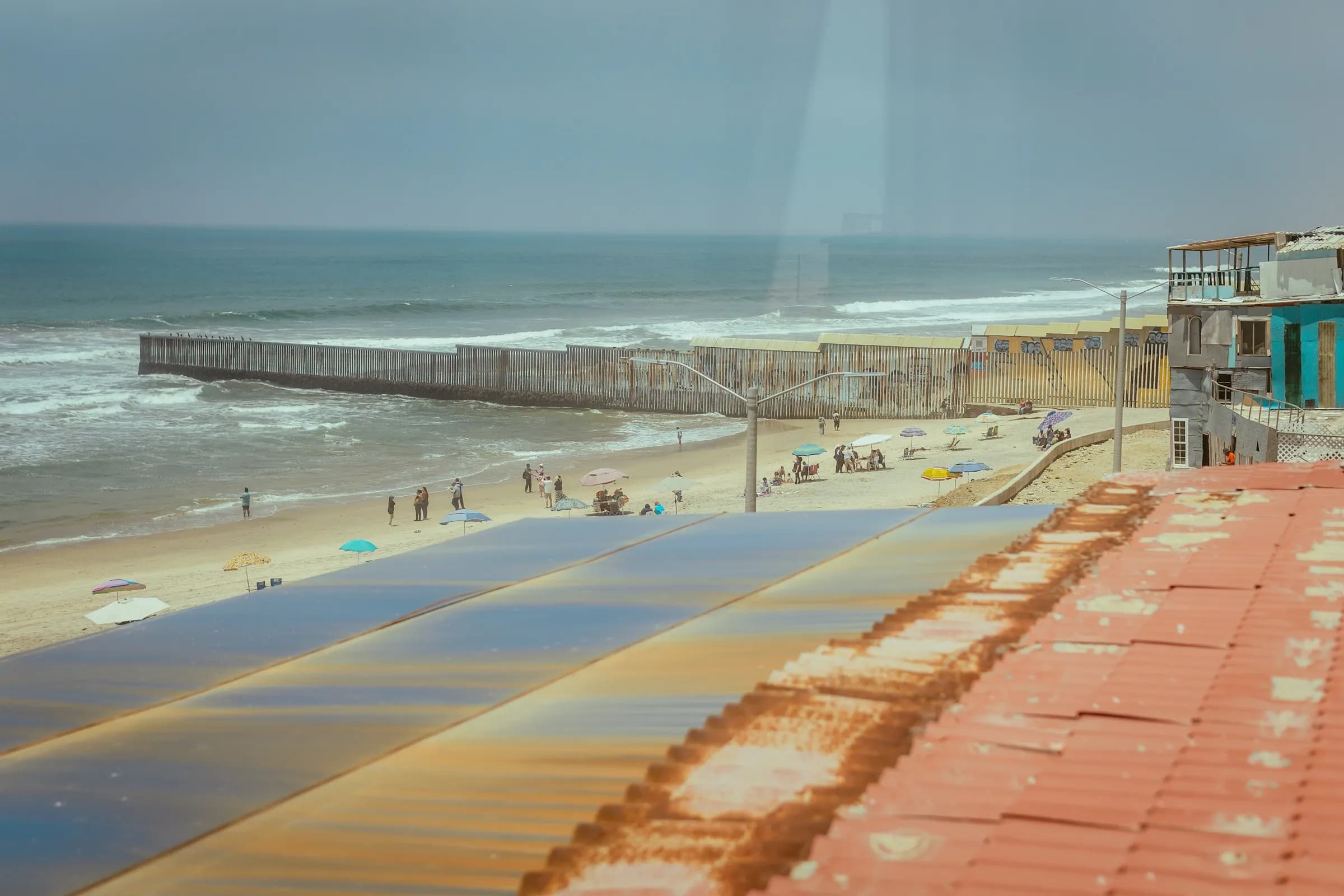 The border fence meeting the Pacific Ocean on the beach between Tijuana and San Diego